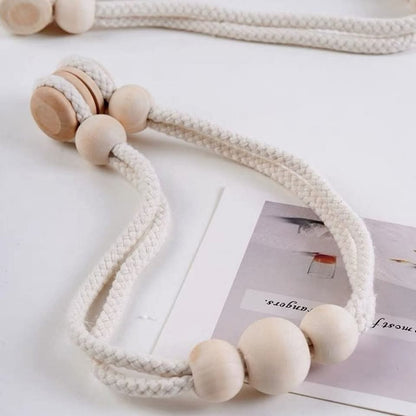 Magnetic curtain tie backs with wooden beads.