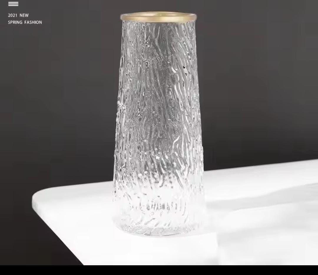 Glass flower vase with Gold rim.