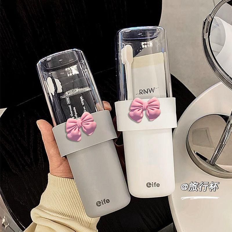 Travel toothbrush/toothpaste holder with a pink decorative bow