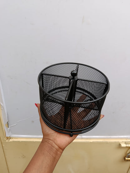 Mesh partitioned rotating cutlery holder.