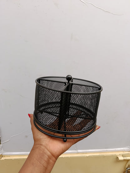 Mesh partitioned rotating cutlery holder.